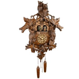 grand coucou à quartz avec hiboux sculptés